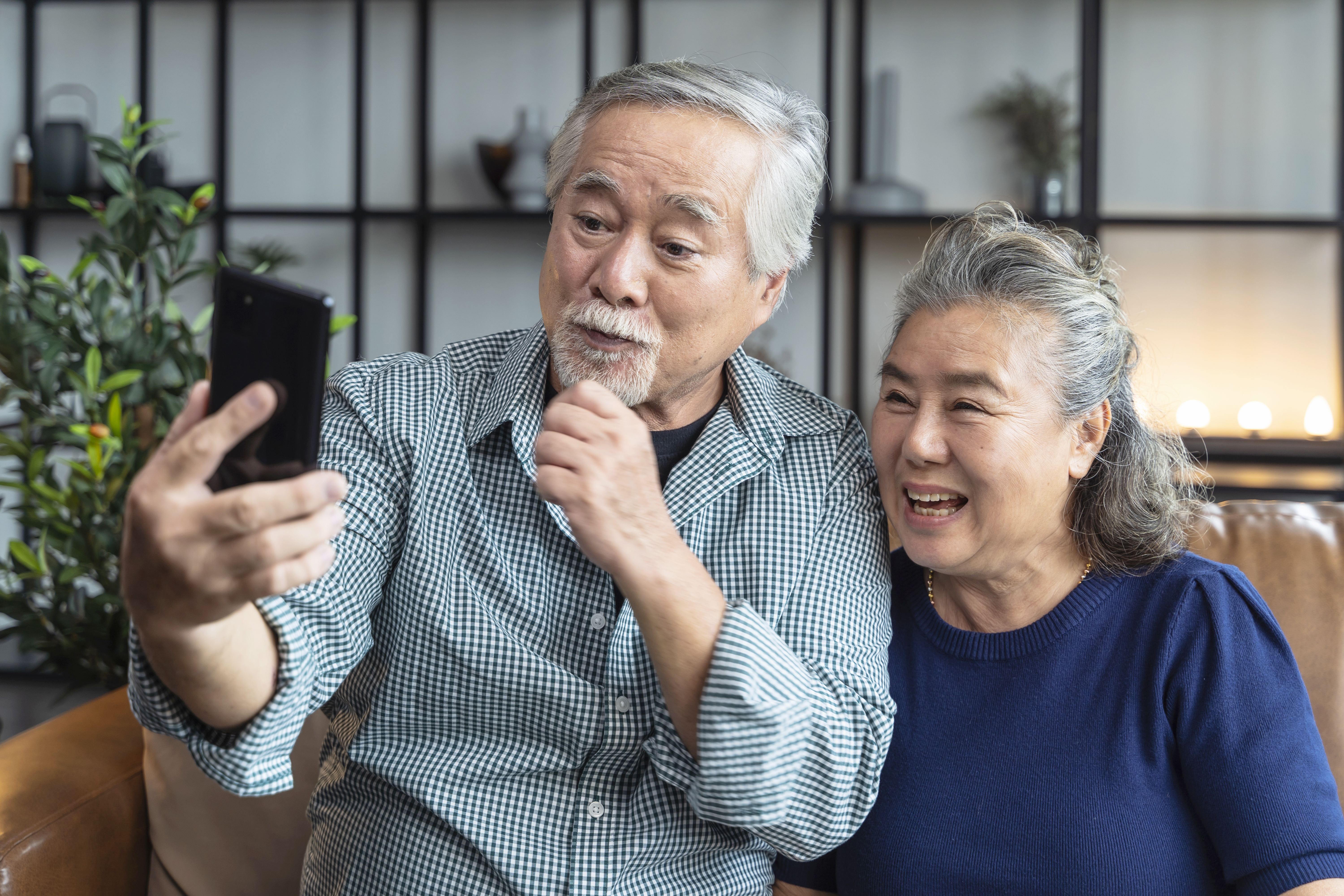 happiness-asian-old-senior-retired-couple-enjoy-videocall-family-together-sofa-living-room-homeasian-people-use-smartphone-communication-family-home-isolation-ides-concept